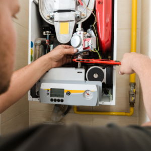HVAC technician doing HVAC maintenance service in Michigan home