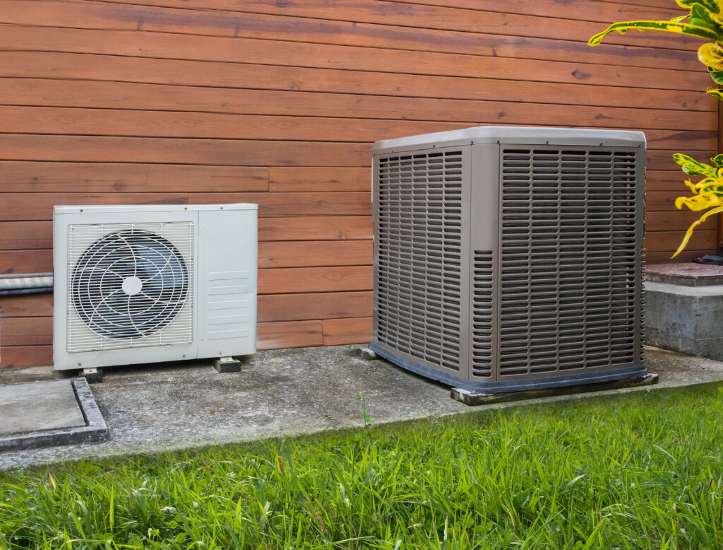 New heat pump next to central AC outdoor condenser unit